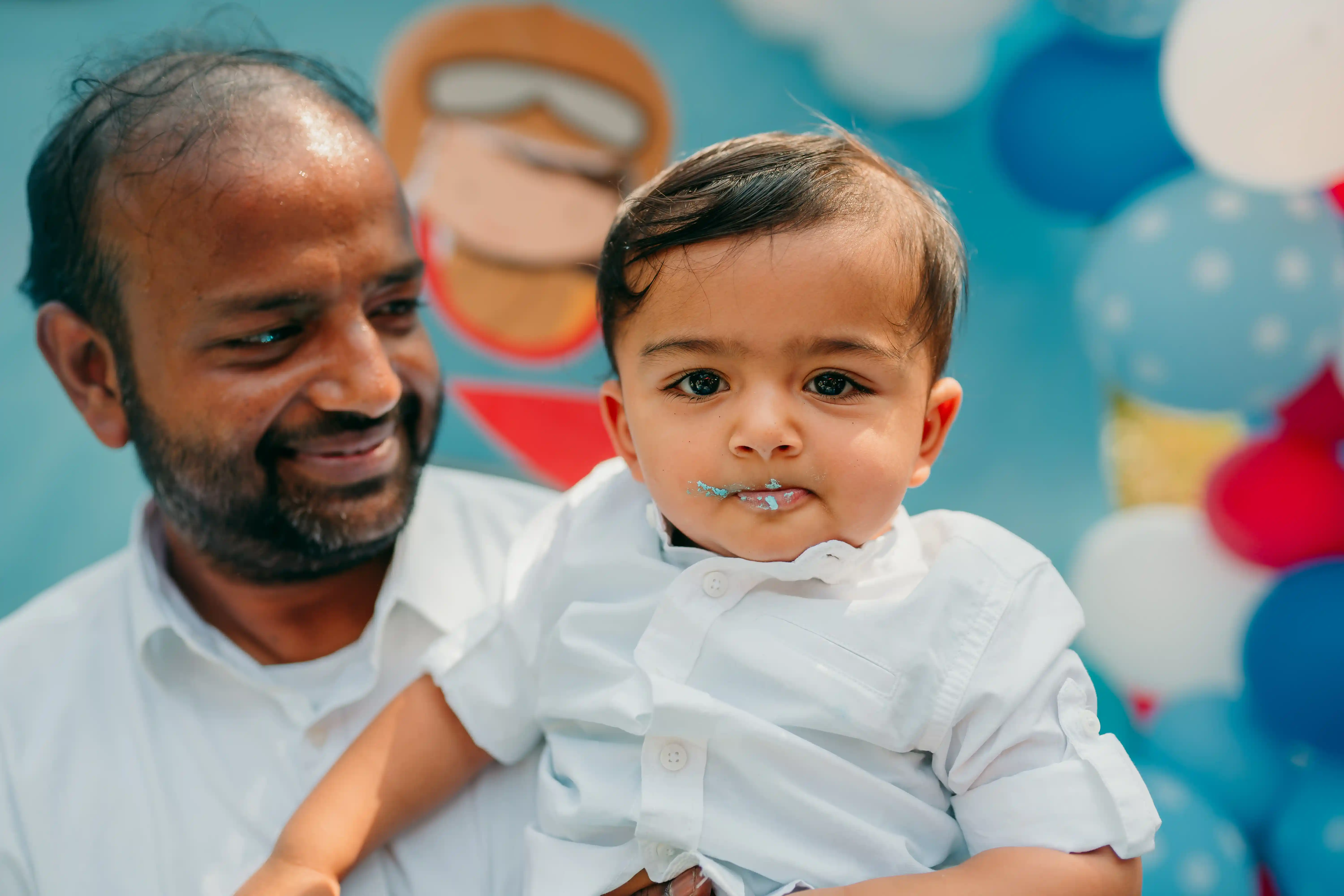 Father and baby birthday portrait